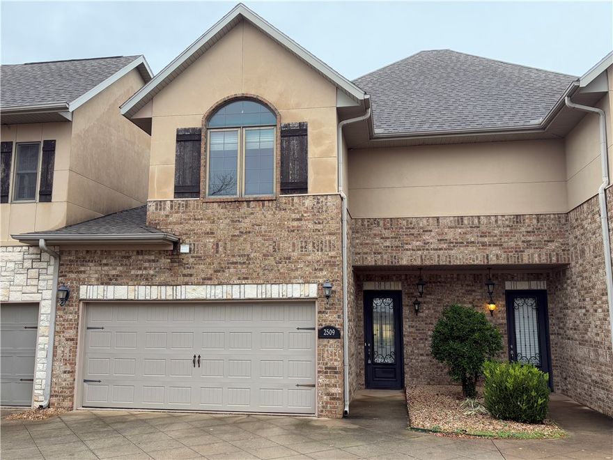 Convenient Location! Nice upscale condo near I-49, Pinnacle Hills Promenade and Mercy. Move-in ready two bedroom/bath suites with bonus landing room upstairs. Open floor plan and half bath downstairs with all appliances including washer/dryer in laundry room with storage adjacent to kitchen. Back patio & 2 car garage. Call for your tour! There is a $400 non-refundable pet deposit; pet to be approved by the Property Manager.