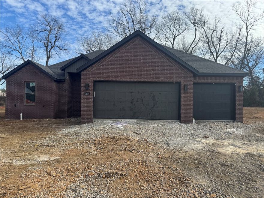 New year, new home! Welcome to this beautiful new construction home in Siloam Springs with a January 30th completion date! This thoughtfully designed 3-bed, 2-bath home offers 2,068 square feet of modern living space with quality finishes throughout. The exterior features classic brick construction, a 3 car garage, & an inviting curb appeal, while inside you’ll find luxury vinyl plank flooring, an open & functional layout, & abundant natural light. The kitchen is equipped with quartz countertops, energy star appliances, eat-in kitchen space, & ample cabinetry. Enjoy outdoor living on the patio. Don’t miss the opportunity to own this move-in-ready new construction home in a growing Siloam Springs neighborhood!