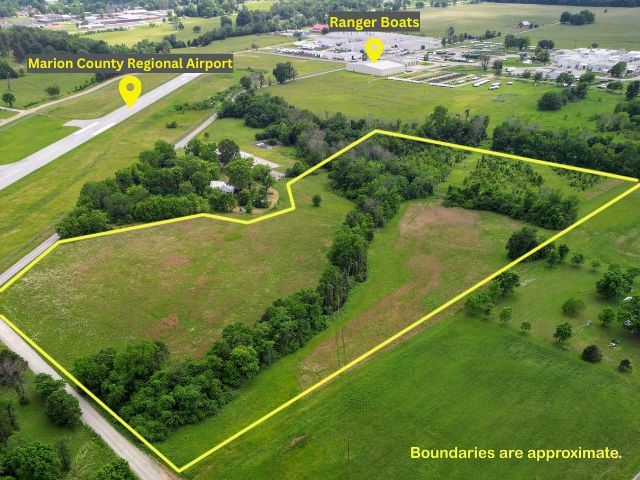 Versatile is the best way to describe this property in Flippin, Arkansas! Located adjacent to the Marion County Regional Airport and just behind Ranger Boats, this 17.91-acre tract offers a unique blend of opportunity and convenience. Some of the main highlights for this property include - county road frontage on two sides, most main utilities available at the road, and a mostly level and cleared terrain. So whether you're looking for residential, agricultural, or potential commercial use, the location supports it all.