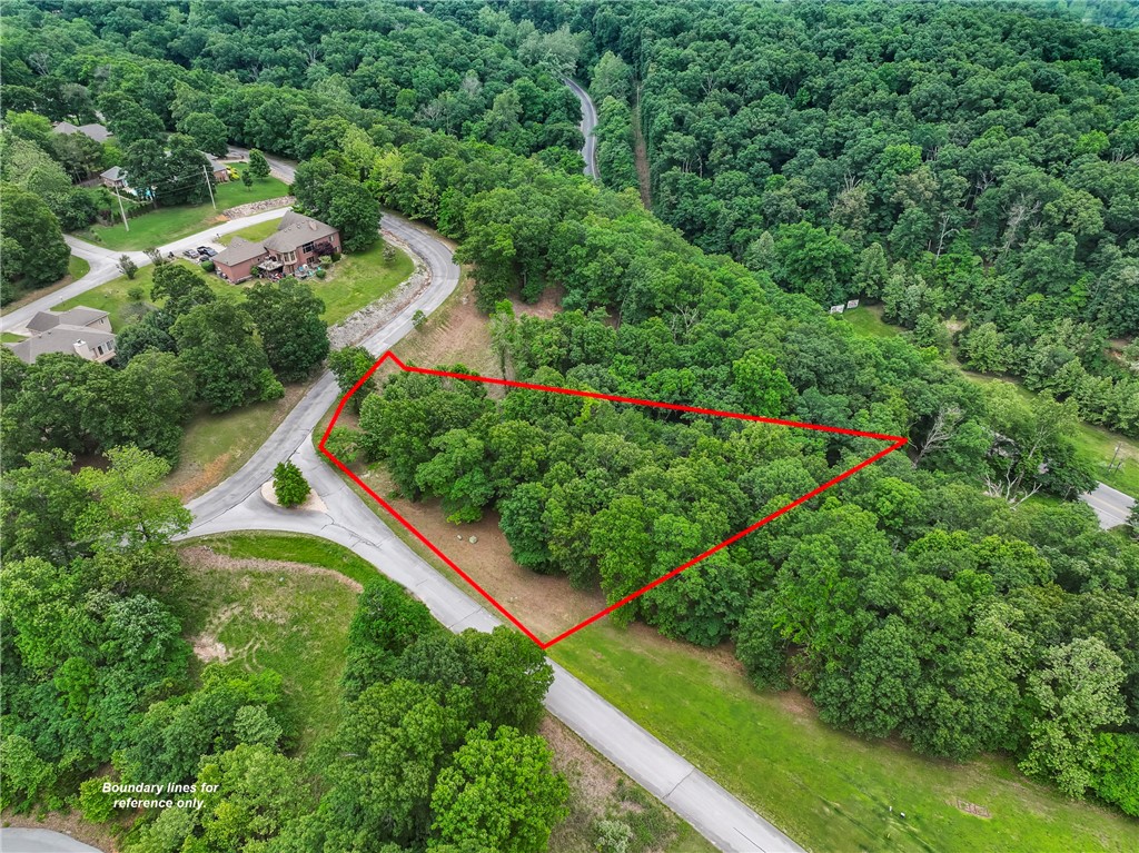 Your dream home awaits in the perfect location. Check out this incredible .99 acre lake area lot that's an absolute gem! Nestled in a well-established neighborhood, it offers the ideal blend of tranquility and convenience, with access to boat ramps and Downtown Rogers just minutes away. Key Distances: Hwy 12 Boat Ramp approx. 5 miles. Prairie Creek Marina approximately 2 miles. Eureka Springs approx. 17 miles. Enjoy the peaceful, private charm of this quiet community while still being close to all the fun and excitement. Don't wait for the life you want, call today!