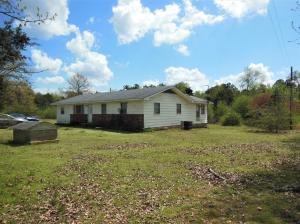 Small price, large home, huge possibilities!! There is so much to love about this spacious 1632 sf home waiting for you to put your touches on it with 2 acres surrounded by peaceful pastoral views! With 3 bedrooms, 2 full baths, bonus room, and even a large mudroom/ utilitiy room, there is space for everything you need! Outside you'll find a charming covered porch and three shops for all your storage and hobby needs. What more could you ask for!