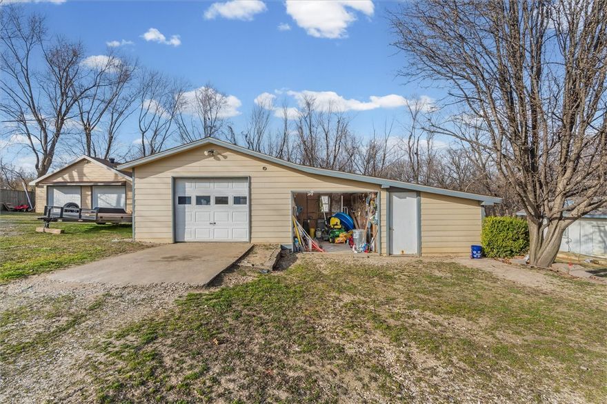 Located in Springdale, this 1-acre property offers a rare opportunity to enjoy rural living while still being just minutes from town. With significant value in the land, this property presents excellent potential for investment, expansion, or creating your own private retreat. The property includes two detached buildings, adding flexibility & function to the space. One outbuilding is heated & cooled with a mini-split system, making it ideal for a workshop, hobby space, home office, or studio. There is also a large unfinished storage building that provides ample room for equipment, vehicles, tools, or future customization. With wide-open space & a convenient location close to shopping, dining, & everyday amenities, this property combines privacy & opportunity in one unique package.