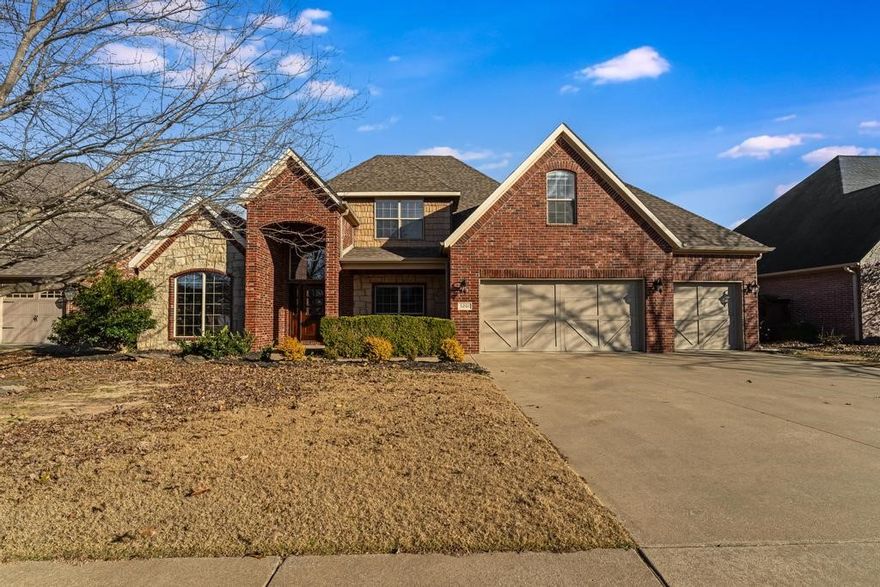 Located in highly desirable Lochmoor Club, this meticulously cared for brick & stone 4-bed, 2.5-bath, split floor plan home comes with a spacious 4-CAR GARAGE! Subdivision amenities include a pool, club house, playground, tennis, basketball, volleyball & pickleball coming soon. The large kitchen features granite counter tops, stainless steel appliances, pantry, tons of cabinets & an eat-in dining space. Beautiful solid wood floors flow throughout the house. Right off the entrance is a dedicated office with built in shelving & French doors for privacy. The dining room space is flexible & can be used as a second living room. The main floor primary ensuite features a tray ceiling, dual vanities, jetted tub & walk-in closet. The three secondary bedrooms are upstairs along with a large bonus room. The level fenced backyard offers outdoor space and privacy. Less than a mile to Bentonville Community Center & close to Central Park Elementary, Bright Field Middle & Fulbright Jr High. Just 5 miles to the new Walmart campus.