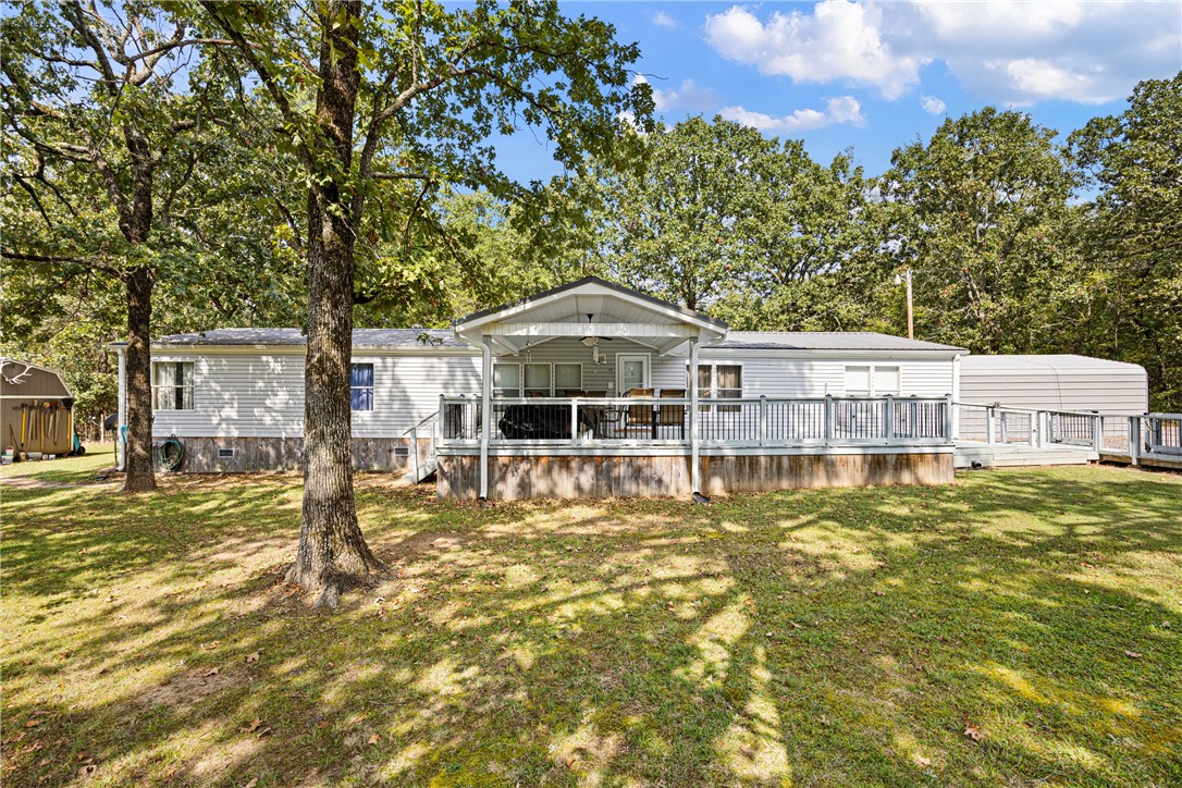 Country living with all the extras! This 4-bedroom, 2.5-bath, 2,280 sq ft home sits on nearly an acre and has been thoughtfully updated inside and out. The spacious floor plan includes an updated kitchen with island, a large master suite with walk-in closet and standing shower, an office, and oversized closets throughout. A pot belly pellet stove provides cozy warmth and energy savings, while the durable metal roof offers long-term peace of mind.
Outdoors, enjoy two decks, a covered front porch, and a fully fenced yard with shade trees. The property also includes two spray-foam insulated sheds with electric—perfect for storage or workshop space—plus a metal carport and an additional garage for vehicles, boats, or projects. With plenty of room to spread out and a peaceful setting just minutes from town, this home blends modern comfort with country charm.