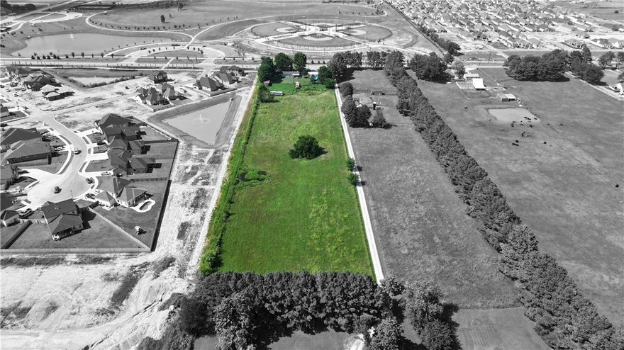 Located directly across from the Shaw Famiy Park in a highly desirable area, this 5-acre ± property offers strong potential for residential development. Surrounded by established and growing communities, the land is suited for future residential development and offers ample space for creative planning. A home currently sits on the property and is being sold as-is, where-is. This is a rare opportunity to secure a large parcel in a growing area with long-term potential. All utilities sit at the corner of this property. Cross posted as land MLS 1315632