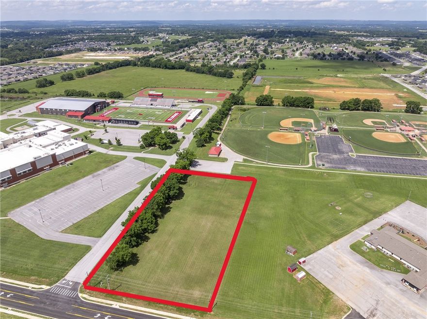 **Prime 2.25-Acre Commercial Opportunity** near the new Farmington High School and ball fields. Located on a developing arterial road designed to divert traffic from Main Street—ideal for visibility and access. Surrounded by growing subdivisions and thriving residential development. Perfect location for indoor pickleball courts, daycare, medical or dental offices, or a neighborhood retail strip center. All uses are subject to city planning approval. Excellent site for forward-thinking investors or developers seeking high-growth potential. Less than 5 miles to I-49, Fayetteville, and all that it offers. Buyer to verify utilities on site and requirements for connections.