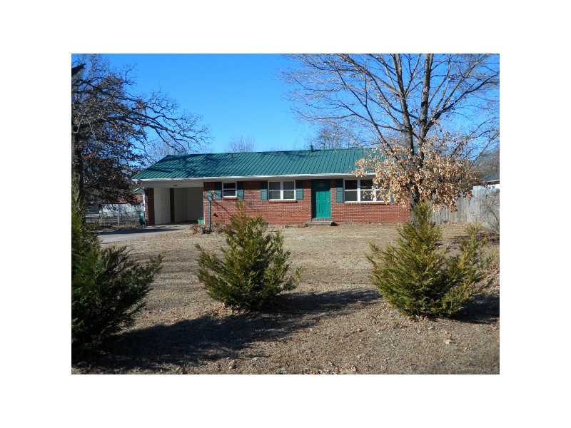 Quaint home has character! refinished hardwood floors! Kitchen recently updated with new countertops, glass tile backsplash, dishwasher & gas range! 3rd bedroom would be good office or den. Huge fenced lot, nice outbuilding & deck! Near Lake Sequoyah!