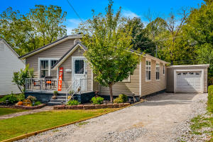 You will love this cottage style home from the moment you pull into the driveway. This home offers great curb appeal with an awesome interior to match. This 2 bedroom 2 full bath home has a great living room with hardwood floors. Nice backyard with privacy fence. Detached unique end to end 2 car garage or great workshop space.