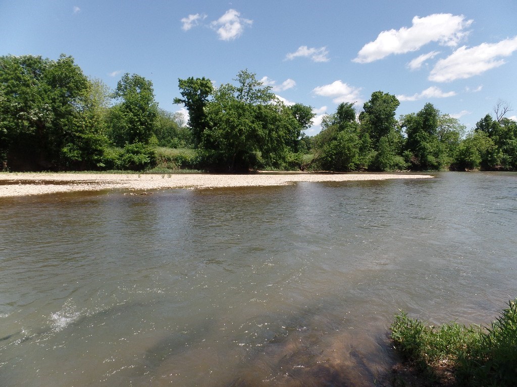 Beautiful 11 acres on the Illinois River! Perfect for recreation. 1 mile downstream of the Siloam Kayak park.