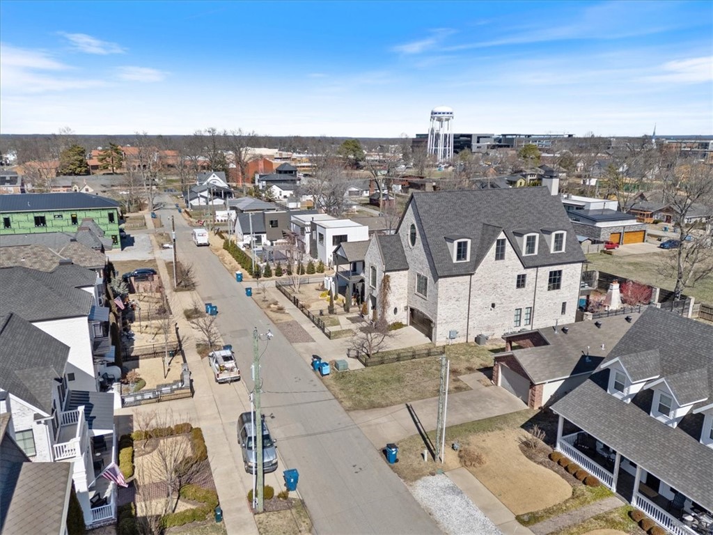 Fantastic Downtown Bentonville Location just a few blocks from the SQUARE. Surrounded by beautiful homes 2 Million+. Cozy 2004 Built brick home located on a stunningly beautiful Downtown Bentonville street. Many options-- Live in it, add-on to it, tear it down to build your DT dream home, AirBNB. Primary value of this property is in the land and location.