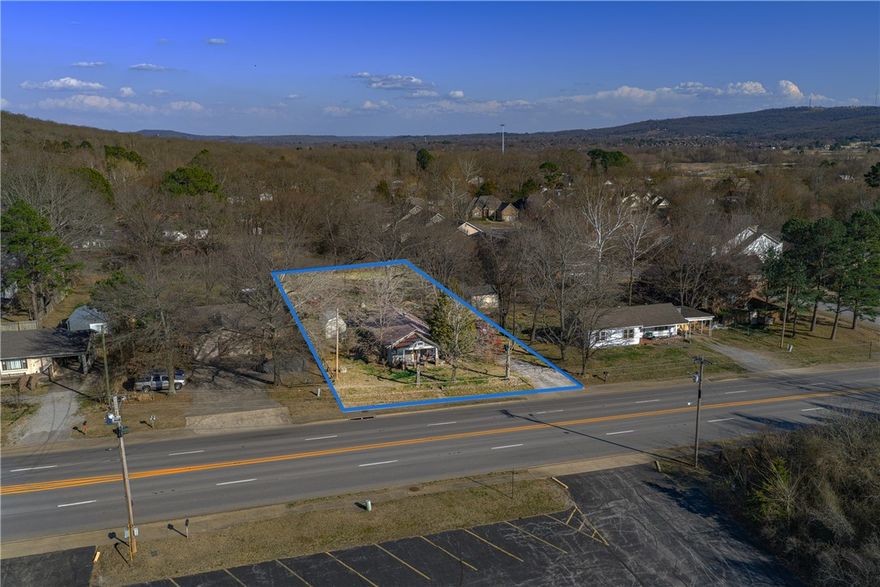 This .51 acres is perfectly situated for potential commercial or multi-family use. The seller has all the information to demolish/remove the house. Also, the home is livable, but the value is in the land.