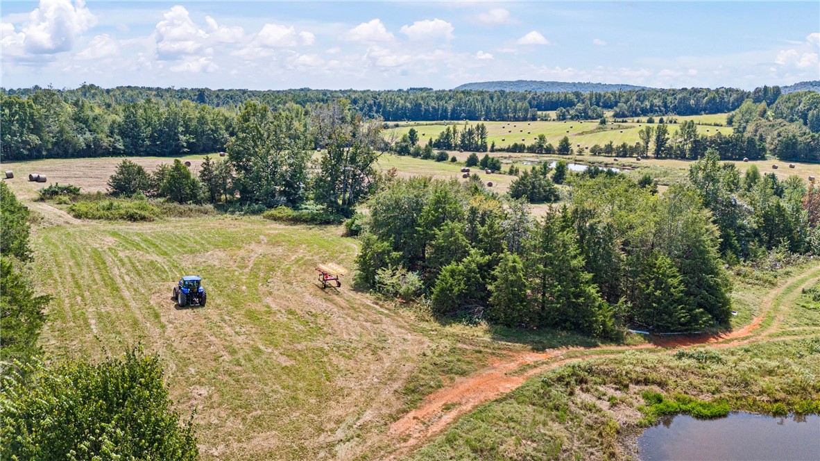 74.30 Acres Located on State HWY 247 complete with great views, ponds, pasture and woods. Easy access to interstate 40 East or West from here. Hay barn with some fence. NO MINERALS TO CONVEY. DEED RESTRICTION NO MOBILE HOMES. Cattle, recreational or just the peace and quiet countryside can all be found on this unique property 1st time ever offered! Some pictures may show a portion of TRACT 2 also for sale MLS# 1322837