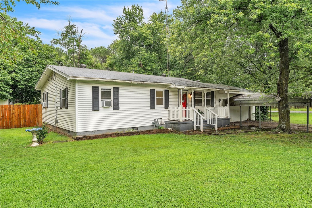 Welcome to 32 N Pollard, a 3 bed, 1 bath home perfectly situated on a spacious 0.31 acre lot in south Fayetteville. Enjoy the ease of low-maintenance living with tile & wood flooring throughout ā NO carpet! The eat-in kitchen opens to a partially covered back deck, perfect for entertaining or relaxing outdoors. A covered front porch adds to the home's charm & provides a welcoming space to unwind. Additional features include a 2-car garage, 2 car carport, & storage shed. The HVAC system will be newly installed prior to closing. Located just minutes from the University of Arkansas, Fayetteville Country Club, Greenland Schools, & the Arkansas Air & Military Museum, this home offers quick access to recreation, education, & local amenities. Whether you're a first-time buyer, downsizing, or looking for a smart investment, this property checks all the boxes!