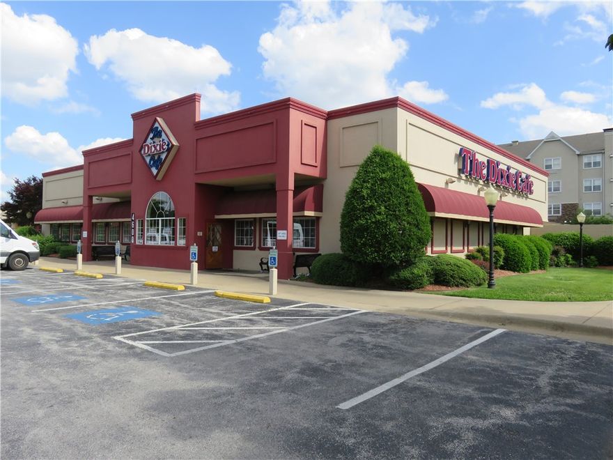 This building is a former Dixie Cafe and it is either for sale or for lease.  It is located in the highly visible Scottsdale Center in Rogers, AR