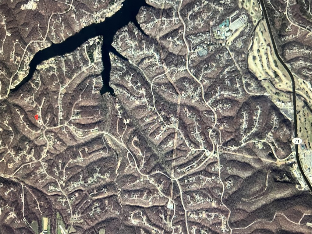 Buildable Lake and Trail Lot! ~600 ft from Wake-Friendly Lake Windsor and ~600 ft from Tunnel Vision Trail near the Up Hills Both Ways intersection!! Beautiful lot off of Pimlico Drive, right off of Chelsea Road And in Bentonville School District! Tweety Bird, Little Sugar, LandLine, Tavistock Canyon, etc and Kingsland Golf Complex and Much more with in 1.5 miles. Access, Opportunity, AND Location with this lot! Bella Vista is a fast growing community exclusively focused on Outdoor Resort & Recreation Living. This lot is in the Southwest Corridor of Bella Vista, as is the newly Oz Trail Park! If you know, you know...