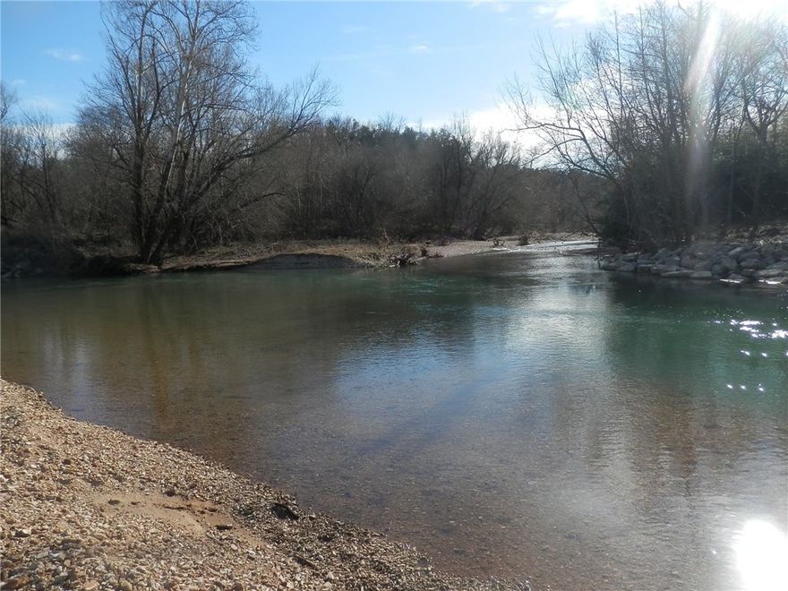 A very rare chance to own 1/2 mile of Kings River frontage! 55 Acres with 6 single family homes that would make a great home place or use as vacation weekly/weekend rentals or long term rentals. Beautiful riverfront property where Keels Creek runs into Kings River with a very large gravel bar that can be used for recreation. Convenient access to property on paved county road. Several acres of pasture nestled between 1000's of pine trees. Lots of possibilities with this property.