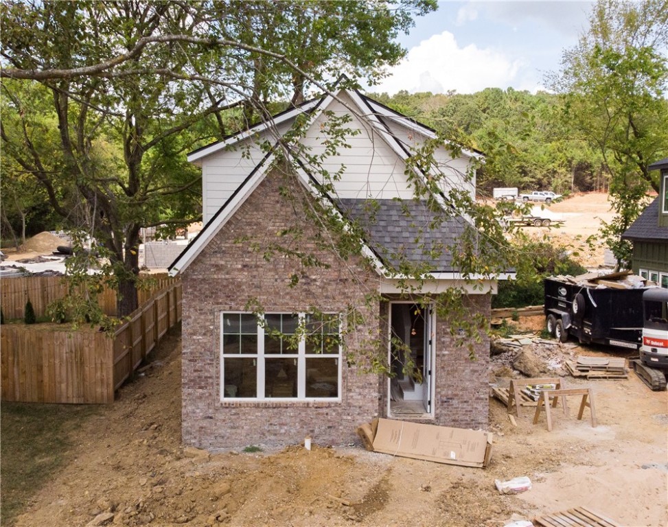 The homes are positioned in West Fayetteville, with Centennial Mountain Bike Park right up the hill and all the shopping and convenience of NWA's largest city nearby! The University of Arkansas is a 5-minute by car commute, at 1.6 miles away. Fayetteville's "Active Transportation Plan" will position a two-lane paved bike trail in front of the home. 3022 and 3026 Old Farmington Rd. will feature three bedrooms and two baths and beautiful modern finishes. Quartz countertops, herringbone bamboo flooring, modern-classic tile work, plenty of natural light, 8-foot front doors, oversized front living room windows, and enough room out back to enjoy the beautiful summer and fall season in the Ozarks. Make an offer and enjoy proximity to 11 miles of top-of-the-line mountain biking trails in the city limits! The homes are spec homes and not customizable. Details for the home are on MLS.