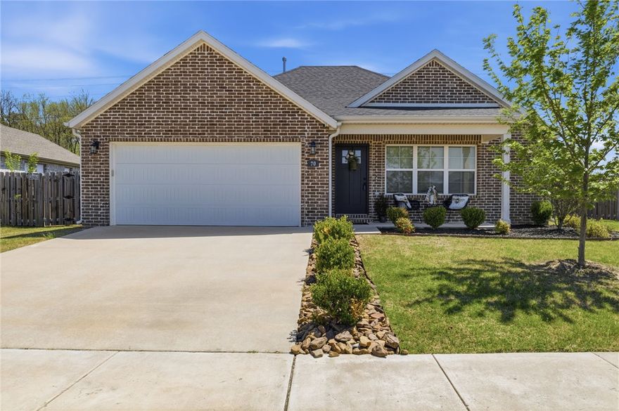 Built in 2022, this BETTER than new 3-bed, 2-bath home sits on a spacious corner lot and offers an open layout designed for easy living. Inside, you'll find wood floors, granite countertops, and modern finishes throughout. Conveniently located directly across from Jerry Pop Williams Elementary School and just a short walk to Farmington's Creekside Park. The neighborhood also features a kids' playground, pool, and clubhouse. Ideal for a first-time homebuyer, investor, or University of Arkansas student, with campus only 15 minutes away.