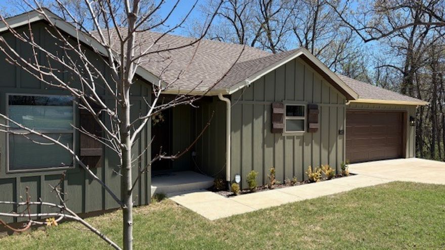 A must see home! Come inside to discover a bright, inviting interior featuring an open-concept living space, abundant natural light, and finishes that create a true sense of home. The kitchen's added island provides additional prep space and a gathering spot for family and friends. Ample cabinetry and a large walk-in pantry/closet has your storage needs covered. Window TDBU blinds throughout the home add privacy and style, not to mention just the right amount of sunlight. Comfortable bedrooms provide restful retreats, with a primary suite designed for relaxation at the end of the day. Step outside to enjoy the covered deck, perfect for morning coffee, evening dinners, or simply relaxing while taking in the peaceful wooded backdrop. This home provides access to many amenities — including golf courses, scenic lakes, walking and biking trails, parks, and recreational facilities. This location offers close proximity to 1 of Bella Vista’s fire departments for peace of mind and easy access to I-49 for your travel needs.