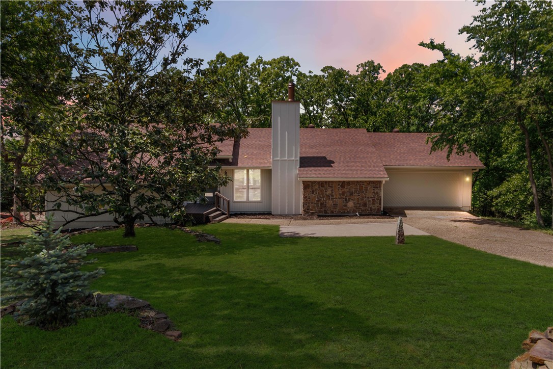 **SELLER OFFERING BUYER CONCESSIONS with competitive offer & $5,000 IN PREFFERED LENDER CREDIT. Step inside this beautifully remodeled turn key 3BR/3BA home on a spacious 0.82-acre lot in desirable Hyland Park! One of the largest lots in the neighborhood, this property offers breathtaking southern views of Devil’s Den.
The main level features a spacious primary bedroom with an en-suite bath and unique sunken shower, plus a second bedroom and bathroom, perfect for flexible living. The inviting living room has a cathedral ceiling and fireplace, making it ideal for both relaxation and entertaining.
On the lower level, you’ll find one bedroom, bathroom/laundry room, a large den or living room, and an additional room for use as bedroom, offices, or storage. This versatile home combines comfort, style, and views—an incredible opportunity in Hyland Park!