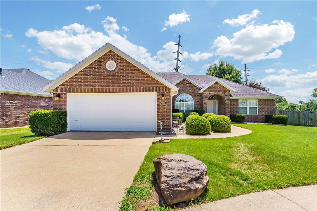 Welcome to this charming brick home nestled in a prime Springdale/Johnson location—just one mile from I-49 and moments from Johnson Mill, trendy shops, and local favorites. You'll love the peaceful view of the Fayetteville Hills from your own backyard, complete with a fenced-in space for added privacy and comfort.
Inside, the open layout blends a cozy living area and formal dining space, anchored by a bright white gas log fireplace. The kitchen features a darling bay window in the breakfast nook and a mix of ceiling styles that add personality throughout the home.
The split-bedroom floor plan offers privacy and functionality, with the spacious primary suite showcasing twin corner windows, a large walk-in closet, dual vanity, a whirlpool tub, and separate shower.
Whether you're looking for a full-time residence, a Northwest Arkansas retreat, or a smart rental investment—this home is full of charm and potential. Come see it for yourself!