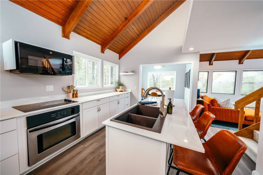 Fully furnished home on Lake Norwood! Located in the heart of the Bella Vista Back 40 Trail, a 5 minute walk to Lake Norwood, Town Center and Cooper Chapel! This beautifully decorated, perfectly appointed home nestled in the forest of Bella Vista makes all those childhood dreams of living in a treehouse come alive. Designed with relaxed textures and a modern artisan style that brings the outdoors inside. Three bedrooms, two full bathrooms, with plenty of basement storage for your bike gear and extras! Four parking spaces provided, including one covered. Rental timeline is negotiable: minimum 30 days up to one year+ terms are possible. Third bedroom is a loft with partial wall open to downstairs.