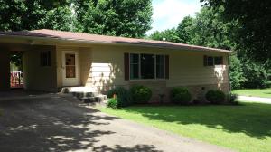 Adorable home in nice neighborhood. Original hardwood floors throughout under carpeting, updated windows, cabinets and heating and cooling. Living room has a large picture window with lots of natural light. This home is well insulated and has low utility bills! Back deck is huge! This house is a must see! New roof 2004, windows 2013, A/C 2010, Heating 2002. New Refrigerator and Washer and Dryer!