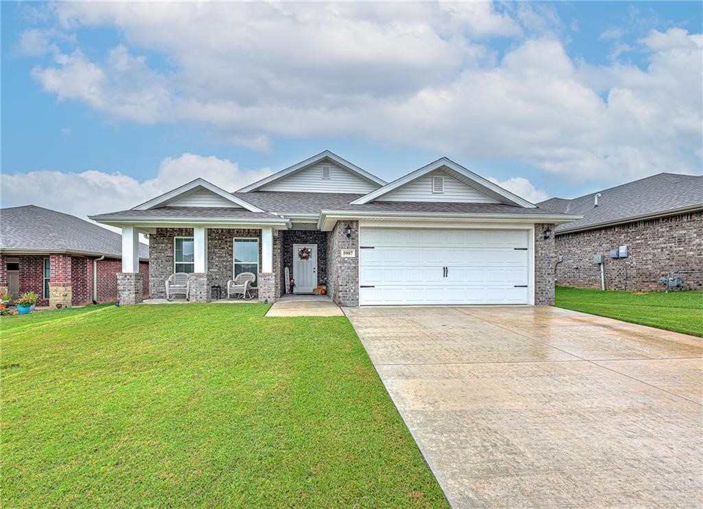 Welcome to this stunning 3-bedroom, 2-bathroom home in the desirable Woodward Hills subdivision! From the moment you arrive, the charming covered front porch invites you in to experience a space designed for both comfort and connection. Inside, you’ll find a thoughtful split floor plan and a bright, open-concept layout that seamlessly blends the kitchen, dining, and living areas—perfect for relaxing evenings or lively gatherings. The spacious eat-in kitchen is sure to be a favorite, featuring a large island ideal for meals, conversation, and entertaining friends and family. The owner’s suite offers a peaceful retreat with a generous layout and a well-appointed bathroom for everyday luxury. Step outside from the kitchen to your covered back patio overlooking a low-maintenance yard—an ideal spot for morning coffee or backyard fun.