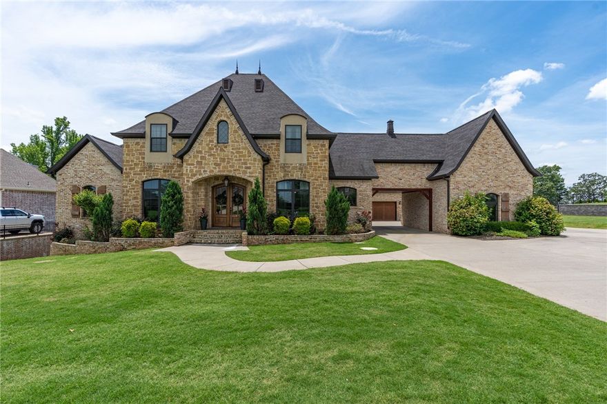 Stunning French Country home nestled on 1.17 acre riverfront lot that offers the warmth and comfort for living as well as a unique design for entertaining and outdoor living. 
The spacious great room features a fireplace and welcoming atmosphere. The kitchen provides large eat-at-bar and plenty of counter space, plus a walk-in pantry and service area. The secluded master suite has a genius storm shelter that doubles as a safe room, his and hers closets located off the master bathroom. Guest suite located on main floor and provides perfect accommodations for overnight visitors. Three more bedrooms on second level, each with walk-in closets. Second level also features a large family room with fireplace and balcony, bonus/fitness room, game room, home theater, and ample storage. 
Community also has perfect clubhouse for entertaining along with community pool. Three fishing lakes located at the front of the subdivision. Along with White River access through the POA property and 200 acres of green-space.