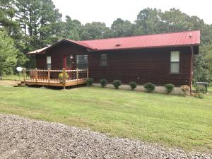 This cozy home sits on 1.5+/- peaceful acres, just on the outskirts of town. Open floor plan with a beautiful large kitchen, granite countertops and with a spacious living/dining area. This space allows for those perfect family moments and good times with friends. Grill out on the new deck while the kiddos play in the large back yard. Enjoy coffee on your front porch each morning and enjoy the wildlife and quiet scenery. The large shop out back is just another bonus!