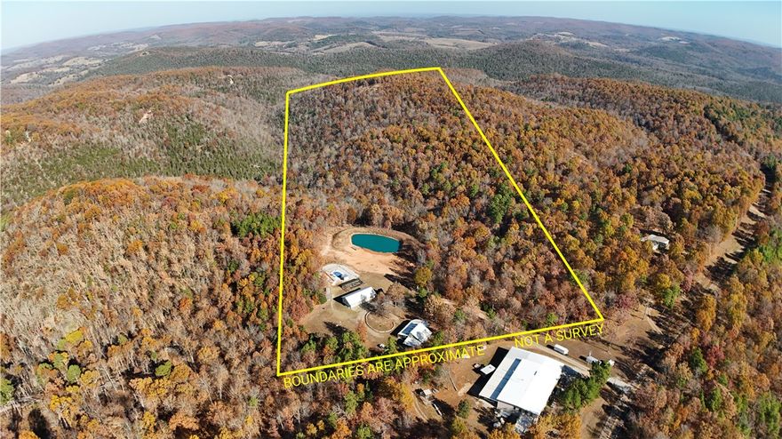 Beautiful country home offering a peaceful setting behind private entry gates with scenic views and abundant wildlife. Interior features include hickory hardwood floors, quartz counter tops and comfortable living areas. Exterior amenities are ideal for recreation, hobby use, and homestead living. Property includes a 5-bay shop with vehicle lift and dedicated paint room, and a full bath. A fiberglass inground saltwater pool, large stocked pond with dock, garden area, chicken house, and a storm shelter for safety and peace of mind. Located near the Buffalo National River, providing access to floating, hiking, camping, and outdoor adventure. A rare opportunity to enjoy privacy, nature, and versatile workspace in one property.