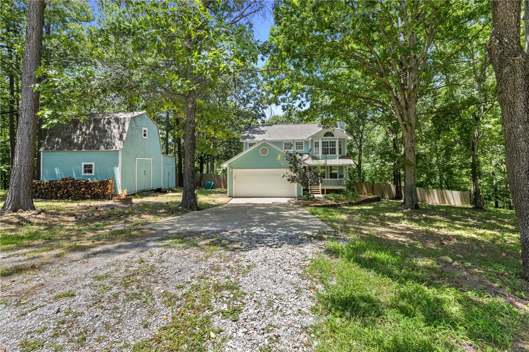 Peaceful Country Living Just Minutes from Town!
Tucked away on nearly 5 private, wooded acres on 2 parcels in desirable Wedington Woods, this 3-bedroom, 2.5-bath home offers the perfect blend of privacy, space, and convenienceājust minutes from the University of Arkansas and all that Fayetteville has to offer.
Enjoy the beauty of nature from one of two spacious decks, ideal for relaxing or entertaining. The home features recent updates including a new roof in 2024, new HVAC upstairs (2023) and downstairs (2020), offering peace of mind for years to come.
A charming chicken coop and chickens are ready for your mini-homestead dreams, and a 500 sq ft workshop provides plenty of room for hobbies, projects, or extra storage. Located on a quiet cul-de-sac, this property is perfect for those wanting space and seclusion without sacrificing accessibility.
Donāt miss your chance to own this rare slice of country living close to town!