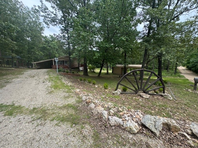 LOCATION..LOCATION…LOCATION.. This spacious home is located minutes from town but sitting on nearly one and a half acres m/l with no restrictions! Also, located not far from the Famous Spring River! Inside you will find three bedrooms, a spacious living room and a basement with a large family room with fireplace! Outside you will a wrap around deck that overlooks the property. This amazing home is waiting for you to come take a look! Buyer to verify all information about property.