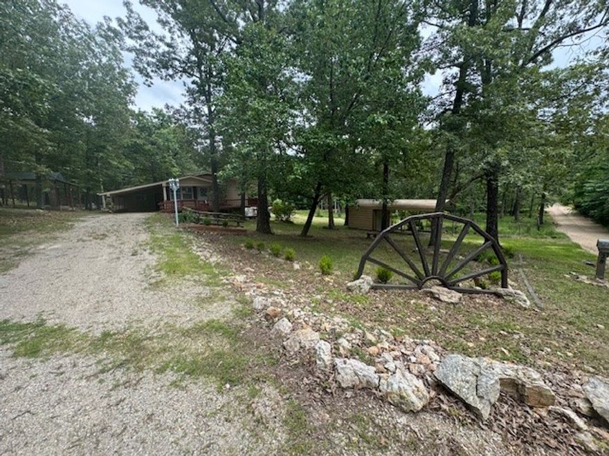 LOCATION..LOCATION…LOCATION.. This spacious home is located minutes from town but sitting on nearly one and a half acres m/l with no restrictions! Also, located not far from the Famous Spring River! Inside you will find three bedrooms, a spacious living room and a basement with a large family room with fireplace! Outside you will a wrap around deck that overlooks the property. This amazing home is waiting for you to come take a look! Buyer to verify all information about property.