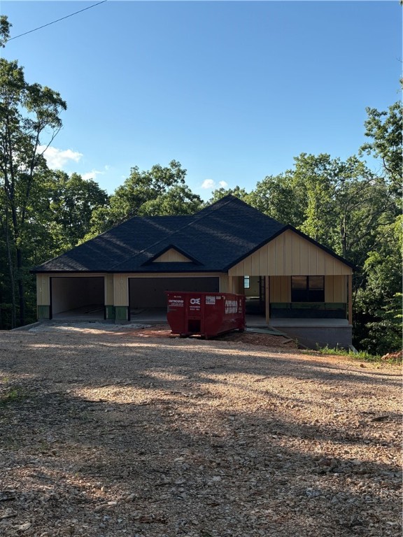 This new construction home has three bedrooms each with an on suite bathroom. Three car garage with a nearly 30' deep boat or RV stall, wifi enabled garage door openers & a EV charger in garage. Bentonville schools, Tunnel Vision bike trail at the back of the lot, built on two lots (.68 acres), knotty alder wood accents, barn door, modern style electric fireplace. One bedroom could easily be used as an office. Recreation or theatre room on the lower level, two porches - one covered roof & screened on the upper. The home is located close to Bella Vista Park/Lake, bike & hiking, plenty of golf courses & lakes to choose from, tennis courts, pools, fitness centers and more.
Estimated completion date 7-31-25