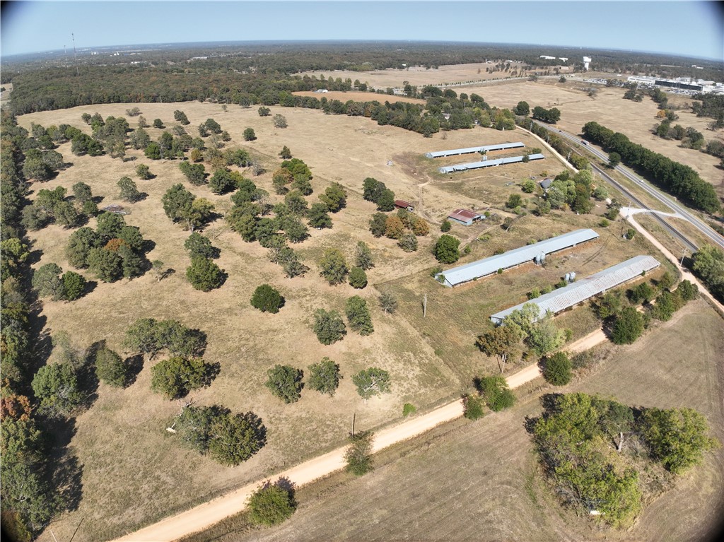 The potential for development here is tremendous. Located just off of Highway 59 and only 18 miles from the Walmart Home Office, this beautiful 85+ acre property is ready for the next sprawling Northwest Arkansas subdivision. It is composed of flat to rolling stretches of land, surrounded by beautiful groves of trees and unforgettable sunsets. Public water and sewer are located near the property and information on that location can be provided to prospective buyers. The property has undergone LIDAR mapping with 3D modeling and data point creation to aid prospective buyers in evaluating the property as well. These are available on request.