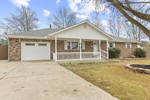 Golf course living at its best! Enjoy quiet time from your all season sunporch looking onto your privacy fenced oversized backyard. An outdoor game area is part of the yard and two storage buildings. One of the ramps to access the Harrison Country Club in your golf cart is just across the street. All brick maintenance free home on the exterior and ALL surface updates on the inside. High quality LVT floors, updated bathrooms, fresh paint, electronic blinds, and more. Space for your golf cart and lawn mower in a fenced-off concrete area. Private master suite with 2 closets. All one level home with only 2 steps to enter the house from the garage.