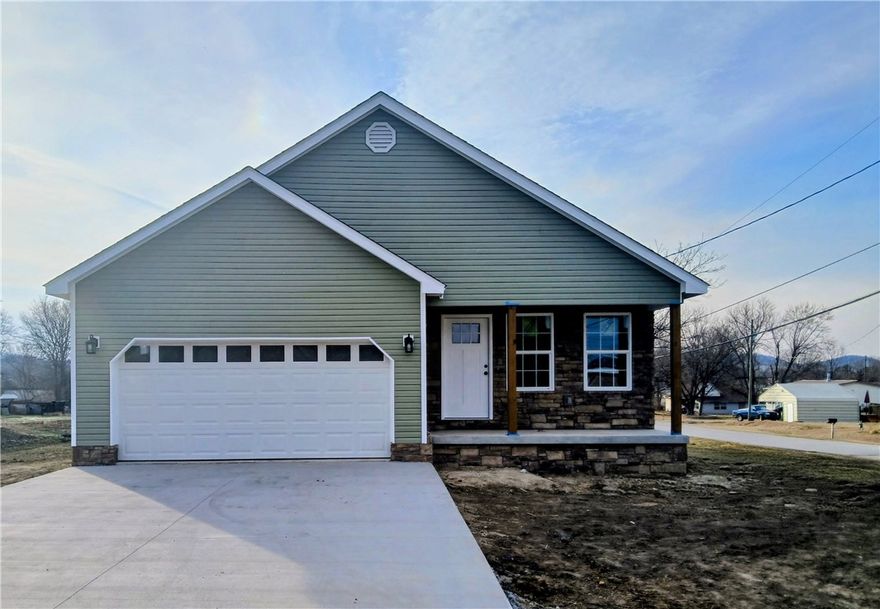 New Construction boosts a gorgeous curb appeal with the stone work outside and neutral Modern colors the inside. This 3 bedroom, 2 bath home welcomes home the owner with a mudroom as you exit the 2 car garage. Step inside and kick those shoes off and hang the coat on the hall tree. Light Oak Colored Luxury Vinyl through out the home makes for easy clean up. Open concept kitchen with Large island gives flow and ability to entertain guests while cooking. New appliances convey in the spacious kitchen with tiled backsplash and light wood cabinetry. Primary bedroom has a large walk in closet with shelving and double vanity sinks for convenience and elbow space. Bring your grill and your lawn chair, this back deck is one you'll be loving for years to come. Walking distance to Green Forest Schools. No showings will be scheduled until March 2, 2026 to allow for construction completion and cleaning