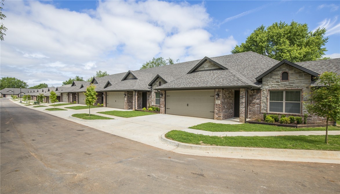 Like new 4 plex in Rogers, just minutes from I-49, shopping and eating. Large open floor plan. Tile style wood flooring thru main living area, carpet in bedrooms, granite counters, stainless appliances, water is paid, refrigerator and lawn care included.