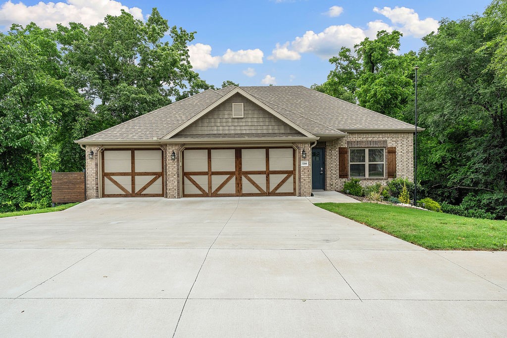 Welcome to 3266 Springhill Ave . . . located in the NW corner of Springdale with upgraded finishes, tons of storage, heated 3-car garage & a park-like 0.42acre lot! The main floor flows perfectly for entertaining & everyday living. On each level, walk out to a large, covered deck overlooking the expansive backyard. Kitchen features a 5-burner cooktop, granite counters & stainless appliances. The oversized living room is spacious, yet cozy. The double-sided gas fireplace is at the heart of both the living room & kitchen. This split floorplan has the primary suite on the main level & 3 secondary bedrooms downstairs. The 4th bedroom has access to the lower deck & is large enough to be used as a bonus room instead of a bedroom. Primary suite has a double sink vanity, tile shower, built-ins & large walk-in closet. Access the huge storage space under the house from inside the house. Close to schools, Razorback Greenway & JB Hunt Park. Back on the market at no fault of the sellers, buyer contingency fell thru.