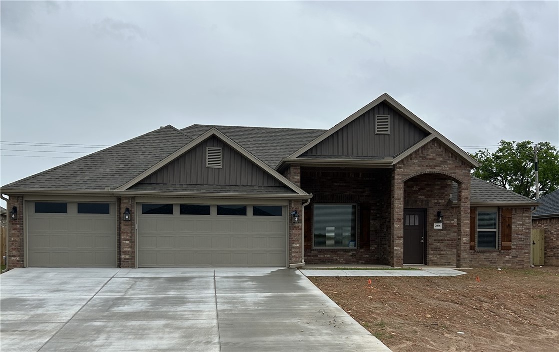 Stunning new constructionāthis single-story home features 3 bedrooms, 2 bathrooms, and a spacious 3-car garage. The kitchen is equipped with stainless steel appliances, a gas range, microwave vent hood, pantry, and granite countertops. A large fireplace flanked with built-in bookshelves serves as a striking centerpiece in the living room. Elegant details include wood-cased windows with 2-inch blinds throughout. Enjoy great curb appeal with a large front porch, fully sodded oversized yard, and a privacy fence. The covered back porch and fully installed gutters add both comfort and functionality. A keyless garage door pad offers convenient access. The primary suite boasts an oversized tiled shower and a walk-in closet that connects directly to the laundry room, located near the garage for added convenience. Durable brick exterior construction ensures longevity and low maintenance.