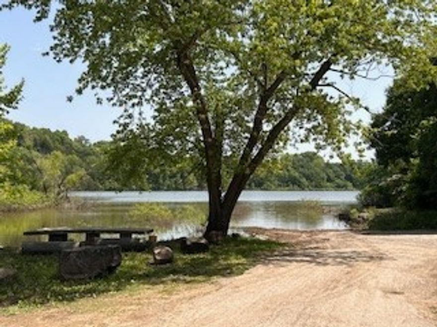 LAKE AREA with Privacy & Bonus Lot makes for a welcoming, peaceful escape! This home is nestled only 1/4 mile to Beaver Lake shoreline, and surrounded by serene woods on three sides, offering the perfect blend of privacy and natural beauty. Enjoy morning coffee or evening relaxation on brand new front and back decks. New carpet, a warm inviting layout that’s perfect for weekend getaways or full-time living. Main Level living welcomes you with a spacious living area, kitchen, and a convenient half bath—ideal for entertaining or relaxing by nature. Downstairs, you'll find two comfortable bedrooms and a full bath. The spacious extra lot included gives you room to expand or simply enjoy the added space. 
Whether you're looking for a cozy personal retreat or an investment property near the water, this property is a must-see! Up to $2500 in CLOSING COST ASSISTANCE! *with acceptable offer & financing approval from preferred lender. Few photos have been digitally staged. USDA/RD Elig., HVAC updated 2020