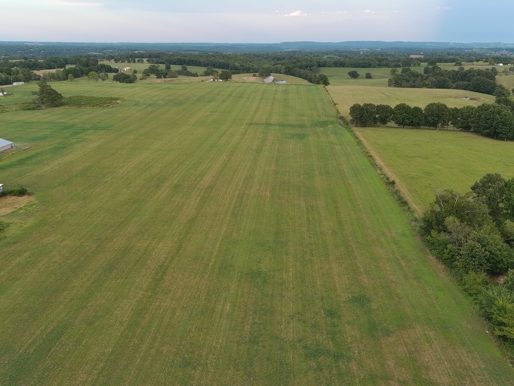 Both County Road and State Highway frontage on this active alfalfa field of 37.20 acres. City Water connection is available at both roadways along with easy connection to Electric. Chicken houses are not on the property but adjacent. Small pond on the property.