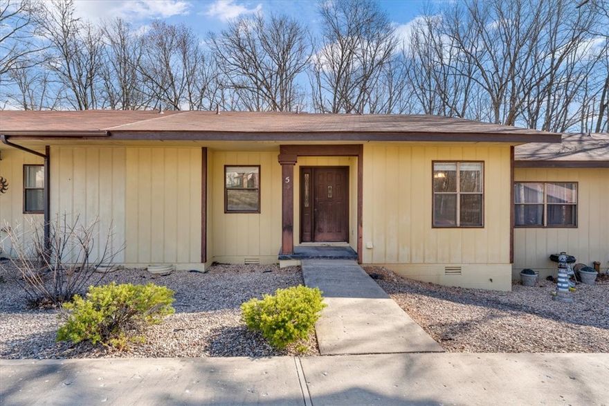 This charming 2-bedroom townhouse offers updated flooring and a private deck, perfect for relaxing or entertaining. The open living and dining area creates a comfortable space to unwind, with plenty of natural light throughout. Enjoy all that Bella Vista has to offer, including seven golf courses, scenic lakes for fishing and boating, miles of world-class biking and hiking trails, community pools, fitness centers, and tennis courts. Whether you're looking for an outdoor adventure or a quiet retreat, this home is in the perfect spot.