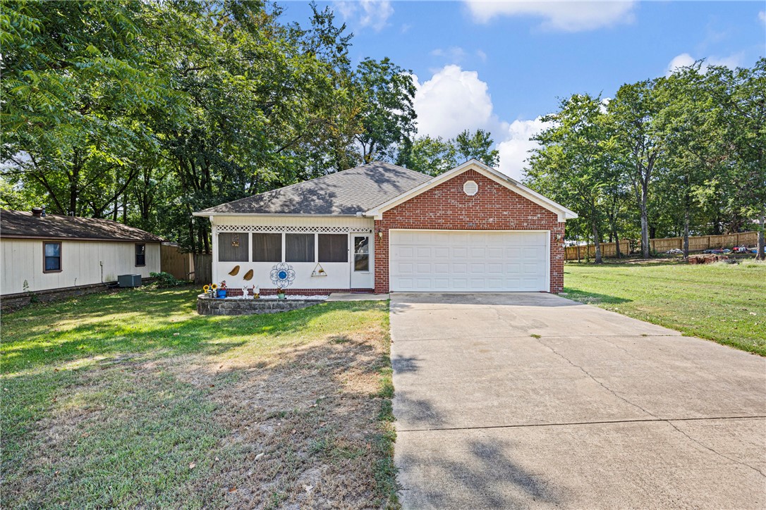Discover this 3-bedroom, 2-bath home built in 2007, offering 1,388 sq. ft. of comfort and style. Nestled on approximately 1 acre in the beautiful small town of Morrilton, it boasts an enclosed front porch, perfect for morning coffee, and a fully privacy-fenced backyard for outdoor enjoyment. Inside, luxury vinyl plank flooring flows throughout, combining elegance with easy maintenance. Enjoy the convenience of being close to everything while savoring the tranquility of a spacious lot. This home is move-in ready and waiting for you to make it your own!