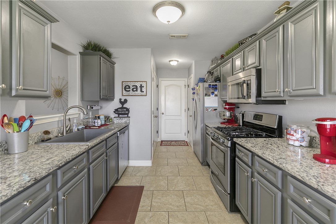 Cute as button, well maintained home in the heart of everything. New paint in the kitchen & LR, new dishwasher and 5" laminate plank flooring in LR and hallway. Seller recently added a gas line for a gas stove cooktop for those chefs. Don't miss this one at this price, you won't be disappointed!