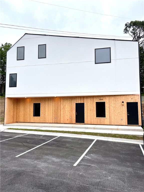 Welcome to this stunning 2 bed/1 bath duplex nestled in the vibrant neighborhood next to the U of A in Fayetteville! This modern gem boasts a stylish design with polished concrete floors that exude elegance and durability. The kitchen is a chef's dream, featuring top-of-the-line GE stainless steel appliances that combine functionality with sleek aesthetics. The LED under counter lights illuminate the space, adding a touch of sophistication to your culinary endeavors. The convenience of a stacked washer and dryer ensures effortless laundry days and recessed lighting creates a warm and inviting ambiance. Don't miss this opportunity to live in a contemporary duplex offering both comfort and convenience in a prime location near the U of A.
