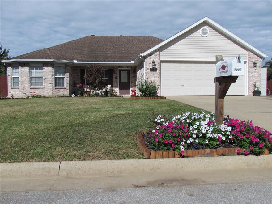 This is a 3 bedroom split floor plan Brick Home with large rooms and walk-in closets, open floor plan. It has a large fenced in back yard with a covered porch / patio for all your outdoor needs, New AC Unit installed in 2016, Full Gutters System around house. It comes with extra parking space available on the side and front of home. Is not far from the U of A and the downtown conveniences of shopping and entertainment and Fayetteville Schools. Included is a 1yr Home Buyer Warranty (American Home Shield)