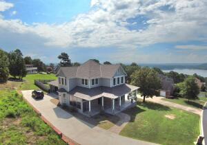 Everything you want in a home! Constructed in 2019, this home has all the features to mark your checklist complete! The master bedroom is located on the first floor and boasts a sunroom right off the bedroom, a large bathroom with a soaking tub and a large walk-in shower. The home is open and has high end amenities, granite countertops, a pantry, and a gas fireplace. There are 3 bedrooms upstairs which makes this a perfect family home. This home also features a beautiful view of Lake Dardanelle and a spacious deck. This home is a must see!