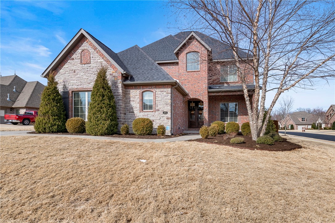 Stunning and Stylish Home in Oak Tree! Gorgeous Features Throughout and quality built! Spacious floorplan with Large Open Living/Kitchen area with Grand Stone Fireplace, and beautiful open staircase to second story. Gourmet kitchen featuring large island and professional series appliances. Master on the main level with 3 bedrooms upstairs and Media Room with Wet bar. Covered back patio features outdoor fireplace with home audio and built-in grill. Large corner lot, fenced backyard, 3 car side load garage.